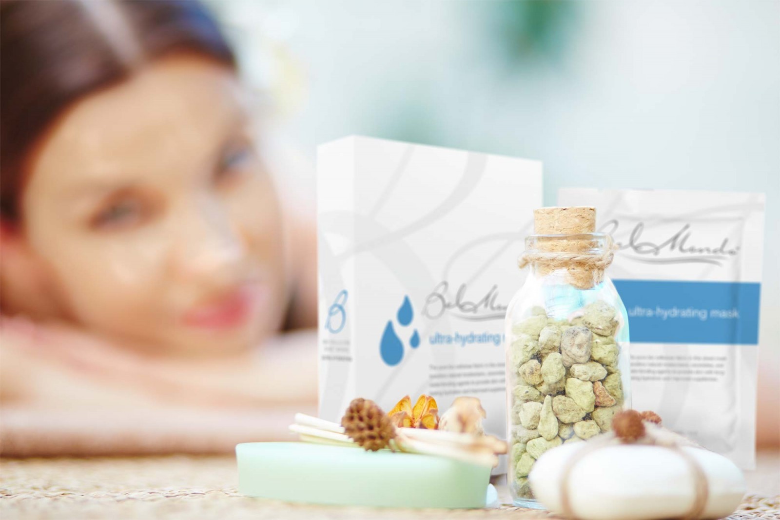 beauty facial treatment with bel mondo bio cellulose mask in the foreground